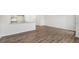 Open dining area with wood-look flooring and kitchen access at 168 Perseus St, Angier, NC 27501