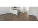 Open dining area with wood-look flooring and kitchen access at 168 Perseus St, Angier, NC 27501