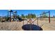 Playground with swings, slides, and a merry-go-round at 168 Perseus St, Angier, NC 27501