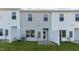 View of townhouses' backyards with patios and fences at 172 Perseus St, Angier, NC 27501