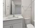Clean bathroom with white vanity, toilet and bathtub at 172 Perseus St, Angier, NC 27501
