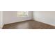 Spacious bedroom featuring a large window and neutral carpeting at 172 Perseus St, Angier, NC 27501