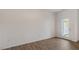 Bright bedroom with wood-look flooring and exterior access at 172 Perseus St, Angier, NC 27501