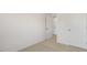 Bedroom with carpet, double door closet and access to another room at 172 Perseus St, Angier, NC 27501