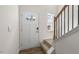 Bright entryway with stairs, wood floors, and a view to the backyard at 172 Perseus St, Angier, NC 27501