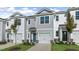 Two-story townhome with gray siding, white trim, and a two-car garage at 172 Perseus St, Angier, NC 27501