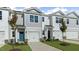 Two-story townhome with gray siding, white trim, and a two-car garage at 172 Perseus St, Angier, NC 27501