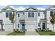 Two-story townhome with gray siding, attached garage, and charming front entry at 172 Perseus St, Angier, NC 27501