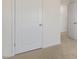 Simple hallway with white doors and neutral carpet at 172 Perseus St, Angier, NC 27501