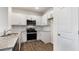 Modern kitchen with stainless steel appliances and granite countertops at 172 Perseus St, Angier, NC 27501