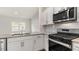 Modern kitchen with stainless steel appliances and granite countertops at 172 Perseus St, Angier, NC 27501