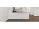 Open concept living area with kitchen island and hardwood floors at 172 Perseus St, Angier, NC 27501
