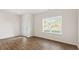 Bright living room with hardwood floors and large windows at 172 Perseus St, Angier, NC 27501