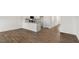 Spacious living room with wood-look floors and an open concept design at 172 Perseus St, Angier, NC 27501
