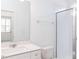 Bright bathroom features a modern sink, large mirror, and sleek glass-enclosed shower at 7404 Prato Ct, Wendell, NC 27591