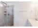 Elegant bathroom featuring a glass shower and vanity with granite countertop at 7404 Prato Ct, Wendell, NC 27591