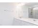 Elegant bathroom with double vanity, granite counters, decorative lighting, and glass shower at 7404 Prato Ct, Wendell, NC 27591
