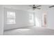 Bright bedroom with plush carpeting, two windows, and a bathroom en suite at 7404 Prato Ct, Wendell, NC 27591