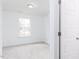 Bright bedroom boasts plush carpet, a window for natural light, and recessed lighting at 7404 Prato Ct, Wendell, NC 27591