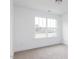 Cozy bedroom with carpet, white walls and a view of the backyard at 7404 Prato Ct, Wendell, NC 27591