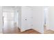 Bright entryway with hardwood floors, white walls, and views into living area at 7404 Prato Ct, Wendell, NC 27591