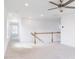 Open landing with carpet and wood railing, featuring recessed lighting and a ceiling fan at 7404 Prato Ct, Wendell, NC 27591