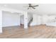 Open living space featuring hardwood floors, open staircase, and a kitchen with a center island at 7404 Prato Ct, Wendell, NC 27591