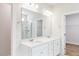 Bathroom features dual sinks, marble shower, walk-in closet, and modern lighting at 472 Barbour Farm Ln, Four Oaks, NC 27524