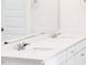 Bathroom featuring a double sink vanity with a large mirror at 472 Barbour Farm Ln, Four Oaks, NC 27524