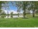 Scenic community lake surrounded by lush greenery, offering a tranquil and picturesque setting at 472 Barbour Farm Ln, Four Oaks, NC 27524