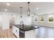 New kitchen with granite counters, stainless appliances, and modern pendant lighting at 472 Barbour Farm Ln, Four Oaks, NC 27524