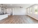 Open floor plan with luxury vinyl plank flooring connecting kitchen to living room at 472 Barbour Farm Ln, Four Oaks, NC 27524