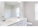 Bathroom features a double vanity, quartz counters, and a large mirror at 576 Barbour Farm Ln, Four Oaks, NC 27524