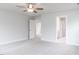 Bright bedroom with neutral walls, carpet, and a view into another room through an open door at 576 Barbour Farm Ln, Four Oaks, NC 27524