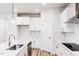 Newly remodeled kitchen with white cabinets and sleek stainless steel appliances at 576 Barbour Farm Ln, Four Oaks, NC 27524