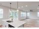 Open-concept living area with view of screened-in porch at 576 Barbour Farm Ln, Four Oaks, NC 27524