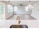 Open-concept living space with hardwood floors and plenty of natural light at 576 Barbour Farm Ln, Four Oaks, NC 27524
