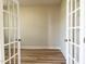 Bright office space with hardwood floors, French doors, and neutral paint, ideal for remote work at 576 Barbour Farm Ln, Four Oaks, NC 27524