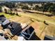 Aerial view featuring homes adjacent to a golf course at 644 Barbour Farm Ln, Four Oaks, NC 27524