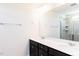 Modern bathroom featuring a double sink vanity with quartz countertops and a tiled walk-in shower at 644 Barbour Farm Ln, Four Oaks, NC 27524