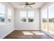 Bright bedroom with wood floors and sliding doors that leads to a wooden deck at 644 Barbour Farm Ln, Four Oaks, NC 27524