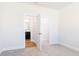 View of bedroom leading into bathroom and walk-in closet at 644 Barbour Farm Ln, Four Oaks, NC 27524