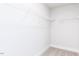 Walk-in closet featuring carpeted floors and wire shelving at 644 Barbour Farm Ln, Four Oaks, NC 27524