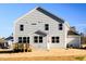 Rear exterior featuring a deck, a patio, and a neatly landscaped lawn at 644 Barbour Farm Ln, Four Oaks, NC 27524