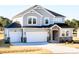 Beautiful two-story home with a two-car garage and stylish stone accents at 644 Barbour Farm Ln, Four Oaks, NC 27524