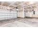 Spacious two-car garage featuring a concrete floor and two garage doors at 644 Barbour Farm Ln, Four Oaks, NC 27524