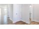 Hallway with hardwood floors leading into bathroom, and other rooms at 644 Barbour Farm Ln, Four Oaks, NC 27524