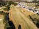 Aerial view of neighborhood homes situated along the golf course at 674 Barbour Farm Ln, Four Oaks, NC 27524