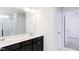 Bright bathroom featuring a double vanity, modern lighting, and a glass-enclosed shower with marble tile at 674 Barbour Farm Ln, Four Oaks, NC 27524