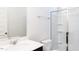 Bathroom featuring a glass shower, a white vanity with dark cabinets and fixtures at 674 Barbour Farm Ln, Four Oaks, NC 27524